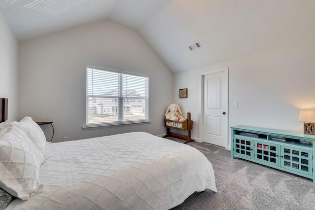 carpeted bedroom with lofted ceiling and visible vents