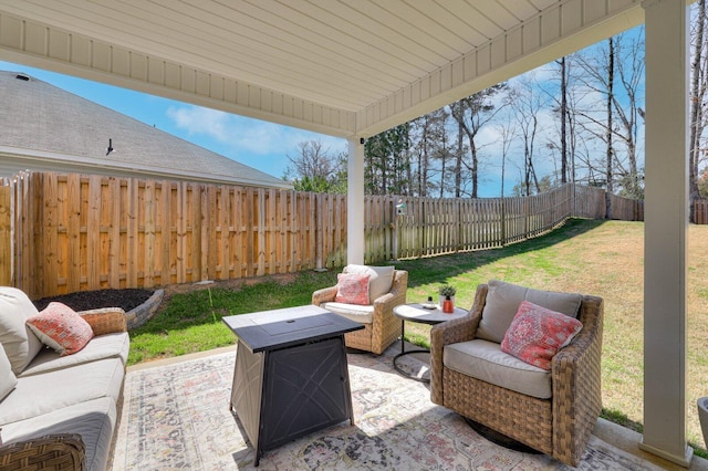 view of patio / terrace with an outdoor living space and a fenced backyard