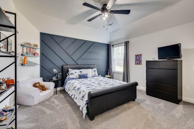 carpeted bedroom with a ceiling fan and baseboards