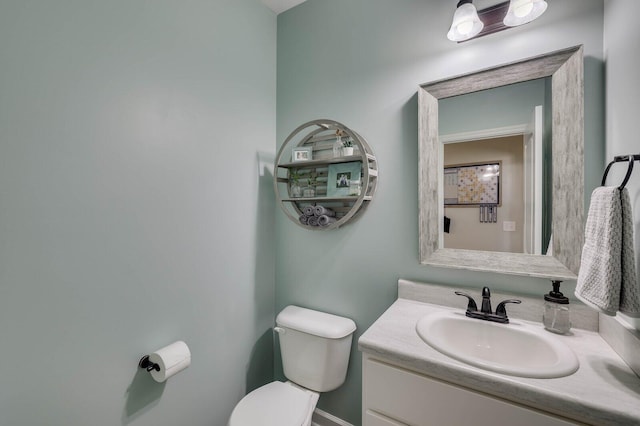 half bath with vanity and toilet