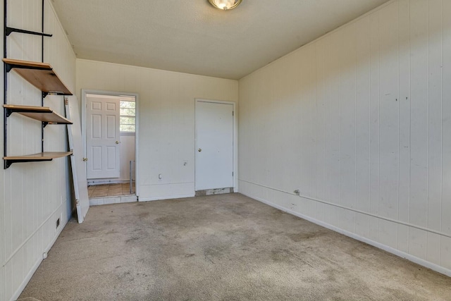 unfurnished bedroom with light colored carpet