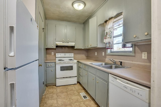 kitchen featuring white appliances and sink