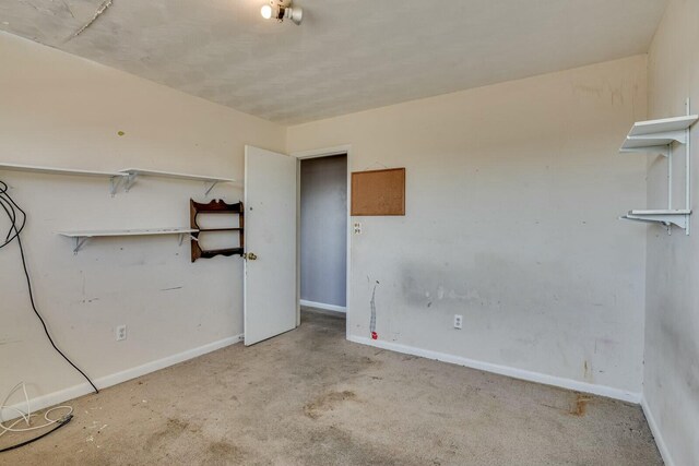 empty room featuring light colored carpet