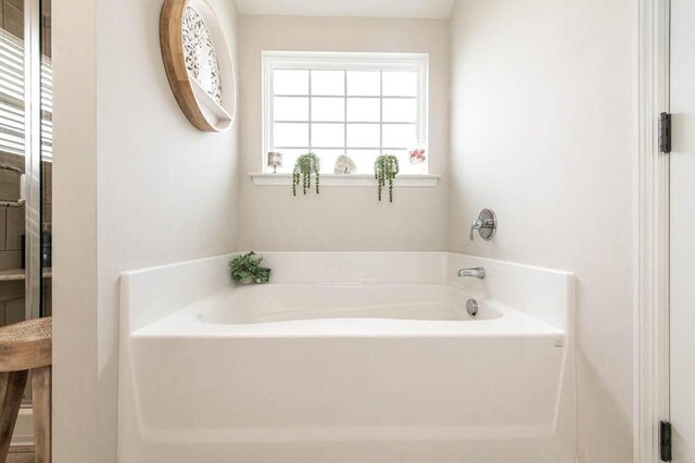 bathroom featuring a garden tub