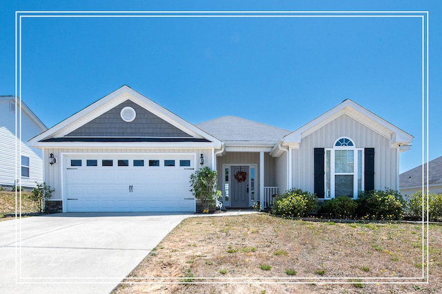 single story home featuring concrete driveway, central AC, board and batten siding, and a garage