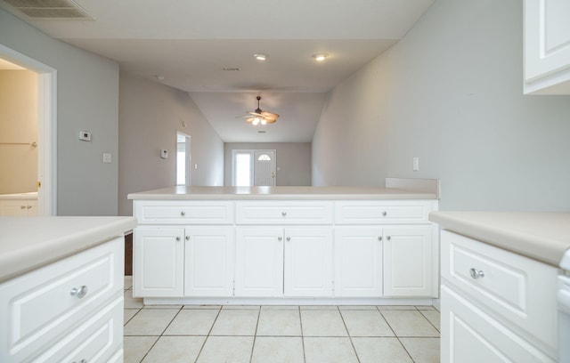 5034 Wheeler Lake Rd, Augusta, GA 30909 - kitchen featuring light tile patterned floors, light countertops, a peninsula, a ceiling fan, and vaulted ceiling
