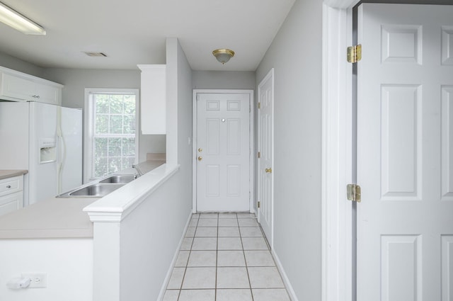 5034 Wheeler Lake Rd, Augusta, GA 30909 - hallway with a sink, baseboards, and light tile patterned floors