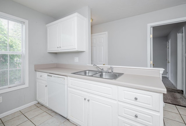 5034 Wheeler Lake Rd, Augusta, GA 30909 - kitchen with dishwasher, a sink, light tile patterned floors, a peninsula, and light countertops