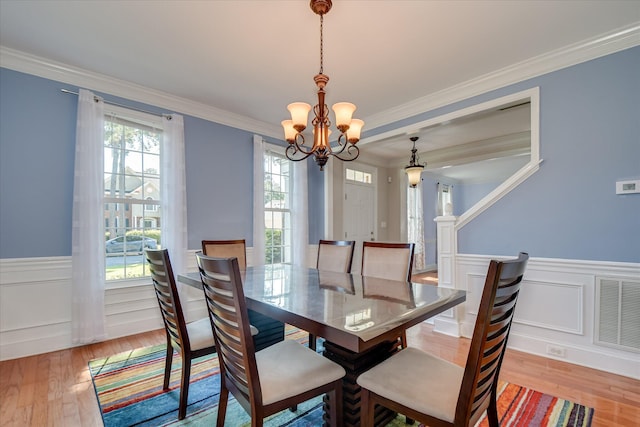 3463 Rhodes Hill Dr, Augusta, GA 30907 - dining room with a chandelier, light wood finished floors, wainscoting, and crown molding