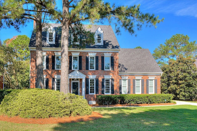 3463 Rhodes Hill Dr, Augusta, GA 30907 - colonial inspired home with brick siding, a front yard, and roof with shingles