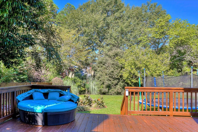 3463 Rhodes Hill Dr, Augusta, GA 30907 - deck featuring a trampoline, a lawn, and view of scattered trees