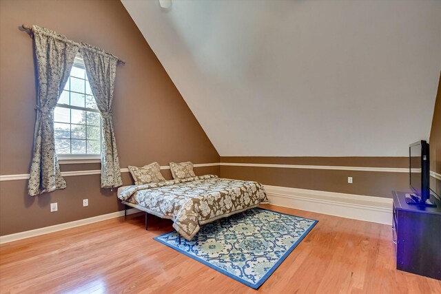3463 Rhodes Hill Dr, Augusta, GA 30907 - bedroom with wood finished floors, vaulted ceiling, and baseboards