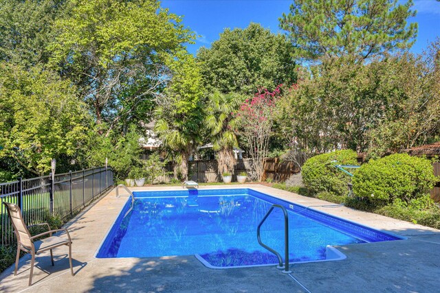 3463 Rhodes Hill Dr, Augusta, GA 30907 - view of pool featuring a fenced backyard, view of scattered trees, and a patio