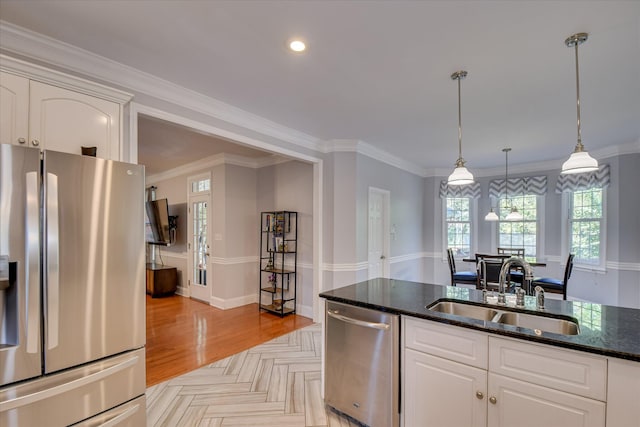 3463 Rhodes Hill Dr, Augusta, GA 30907 - kitchen featuring appliances with stainless steel finishes, a sink, dark stone counters, white cabinetry, and pendant lighting