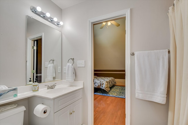 3463 Rhodes Hill Dr, Augusta, GA 30907 - bathroom with toilet, vanity, wood finished floors, and ceiling fan