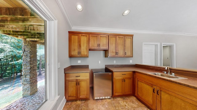 kitchen featuring sink, stainless steel fridge, and ornamental molding