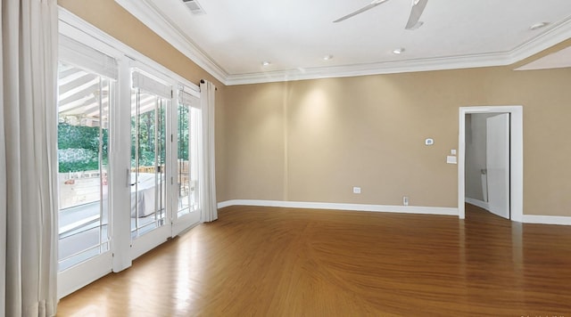 empty room with ceiling fan, ornamental molding, and hardwood / wood-style floors