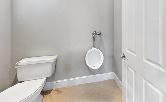 bathroom with tile patterned floors and toilet