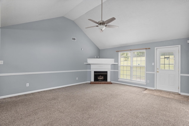 4308 Felmellow Dr, Grovetown, GA 30813 - unfurnished living room featuring carpet floors, lofted ceiling, ceiling fan, a fireplace with raised hearth, and baseboards