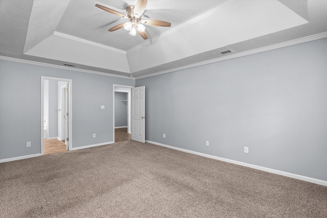 4308 Felmellow Dr, Grovetown, GA 30813 - unfurnished bedroom with a tray ceiling, carpet floors, baseboards, crown molding, and a spacious closet