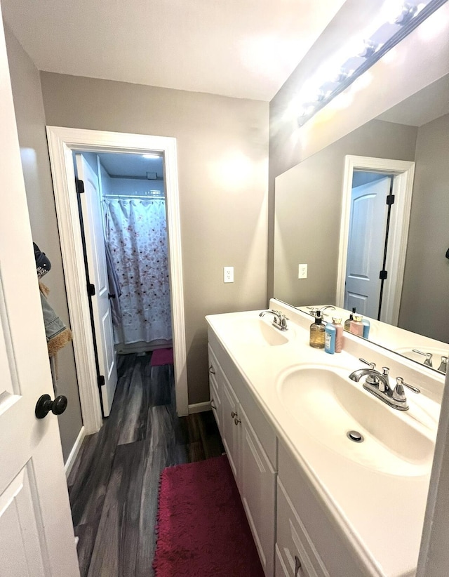 bathroom featuring vanity, hardwood / wood-style floors, and a shower with curtain