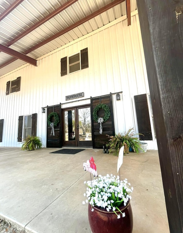 view of exterior entry featuring french doors