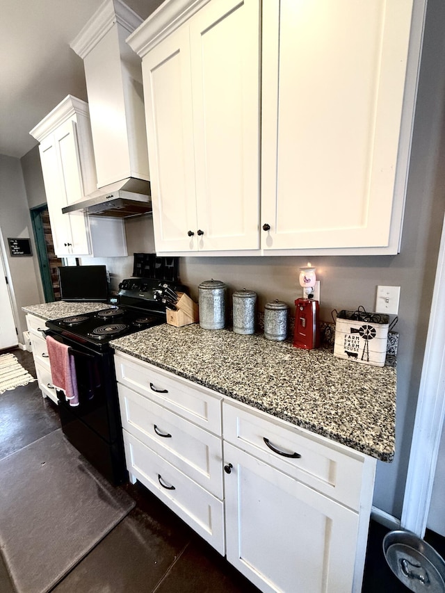 kitchen with white cabinetry, black range with electric stovetop, light stone countertops, and wall chimney range hood