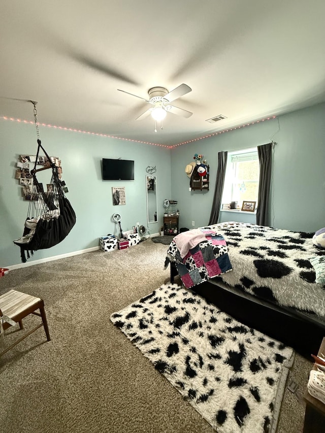 bedroom with ceiling fan and carpet