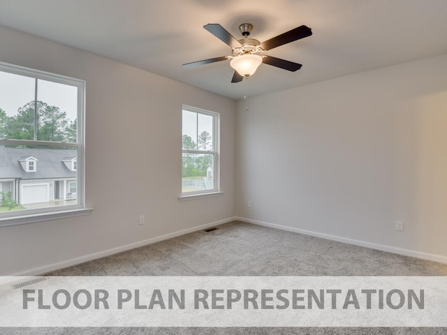 carpeted spare room with a wealth of natural light and ceiling fan