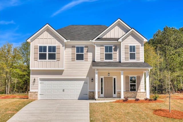 1428 Elias Sta, Thomson, GA 30824 - view of front facade with a front yard and a garage