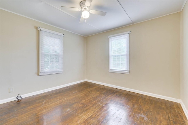 spare room featuring dark hardwood / wood-style floors and ceiling fan