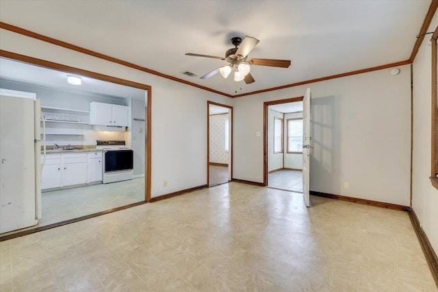 interior space featuring ceiling fan, sink, and ornamental molding