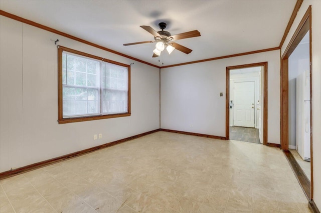 unfurnished room with ceiling fan and crown molding