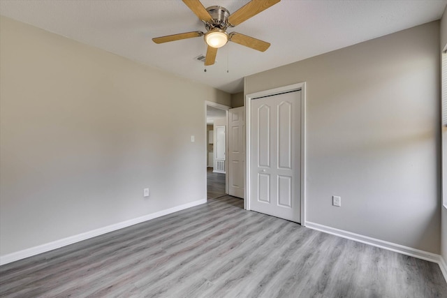 2913 Kings View Dr, Augusta, GA 30909 - unfurnished bedroom featuring light wood-type flooring, a closet, and ceiling fan