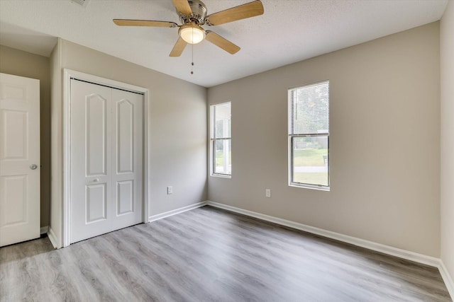 2913 Kings View Dr, Augusta, GA 30909 - unfurnished bedroom with wood finished floors, a closet, and ceiling fan