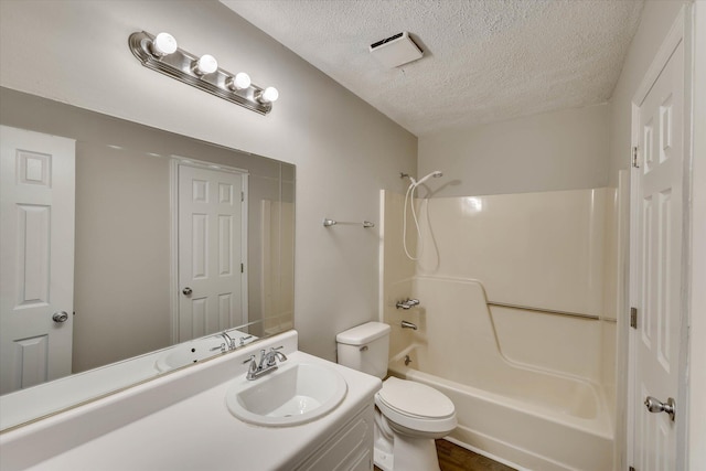 2913 Kings View Dr, Augusta, GA 30909 - bathroom with a textured ceiling,  shower combination, vanity, and wood finished floors