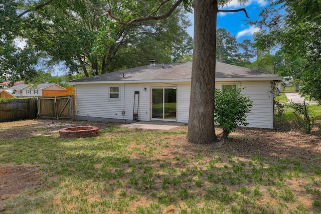 2913 Kings View Dr, Augusta, GA 30909 - back of property featuring a fire pit, a patio area, and a gate