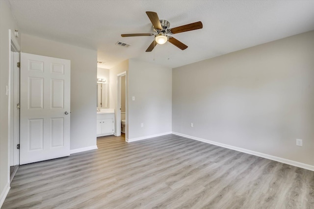 2913 Kings View Dr, Augusta, GA 30909 - unfurnished bedroom featuring light wood-style flooring, connected bathroom, and a ceiling fan