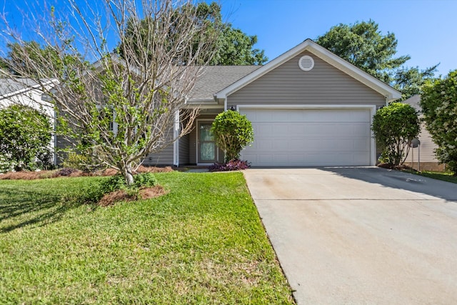 ranch-style home with a garage, a front lawn, and driveway