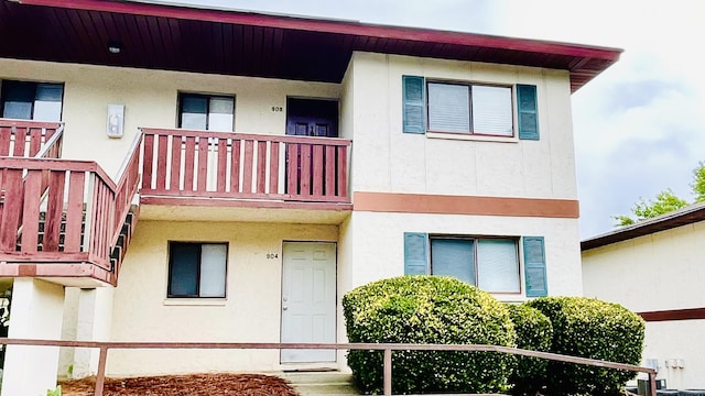 view of front of property with a balcony