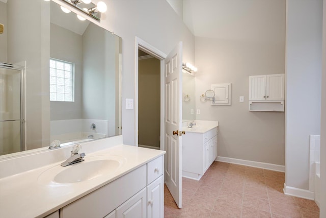5107 Windmill Pl, Evans, GA 30809 - bathroom featuring two vanities, a garden tub, a shower stall, and tile patterned flooring