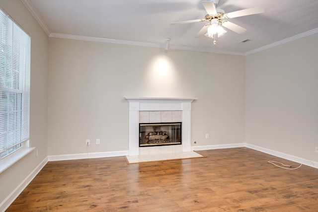 5107 Windmill Pl, Evans, GA 30809 - unfurnished living room with wood finished floors, ceiling fan, ornamental molding, and a tiled fireplace