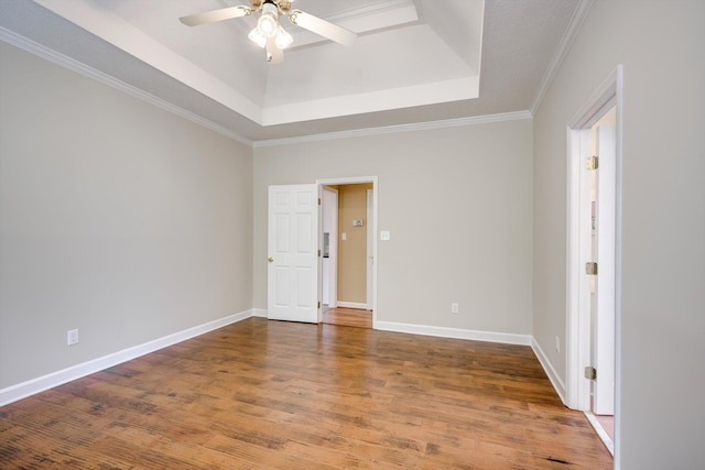 5107 Windmill Pl, Evans, GA 30809 - empty room with a tray ceiling, a ceiling fan, wood finished floors, and crown molding