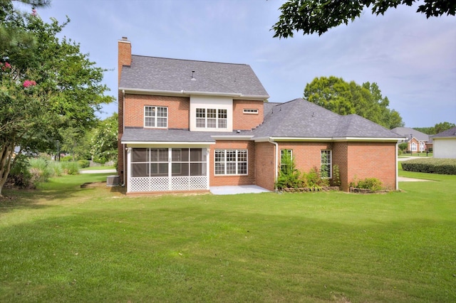 5107 Windmill Pl, Evans, GA 30809 - rear view of property featuring a chimney, a lawn, a sunroom, and brick siding