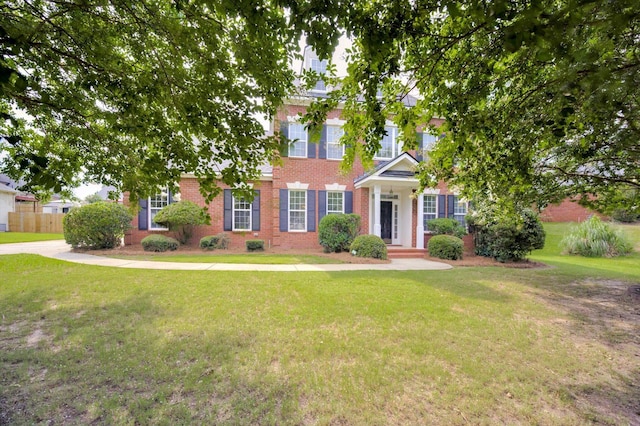 5107 Windmill Pl, Evans, GA 30809 - colonial-style house with brick siding and a front yard
