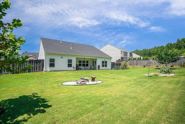 3076 White Gate Loop, Aiken, SC 29801 - rear view of property with a fenced backyard and an outdoor fire pit