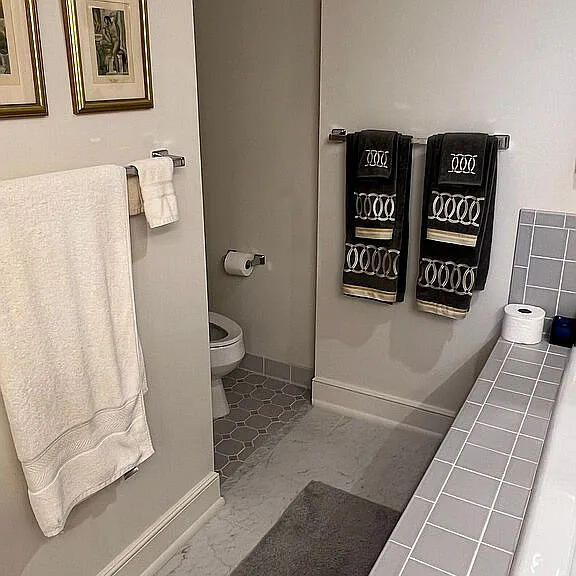 bathroom featuring tile patterned flooring and toilet