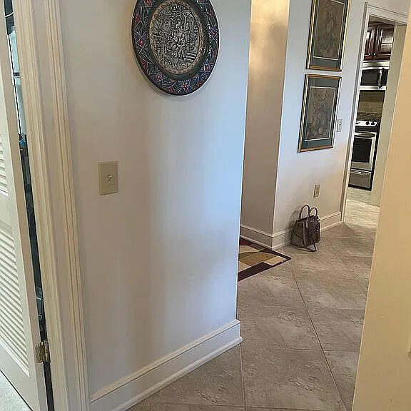 corridor with light tile patterned floors