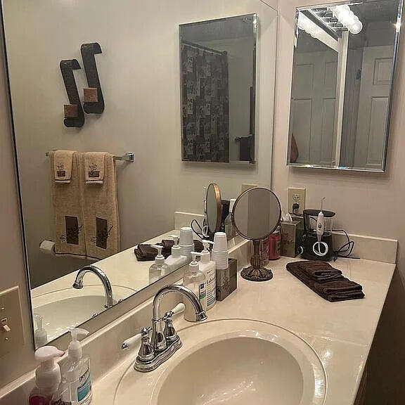 bathroom with vanity and a shower with shower curtain