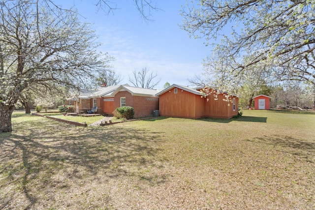 exterior space featuring an outbuilding and a shed